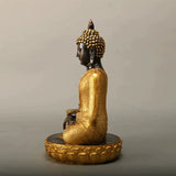 Statue Bouddha dorée sur socle lotus