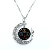 Pendentif lune et glyphes, cabochon verre