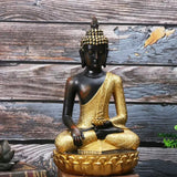 Statue Bouddha dorée sur socle lotus