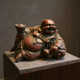 Statue Bouddha rieur allongé porté