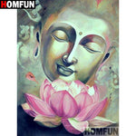 tableau zen avec bouddha et fleur rose a coté
